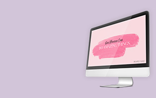 A desktop computer is shown with a One Woman Can wallpaper from Mary Kay.