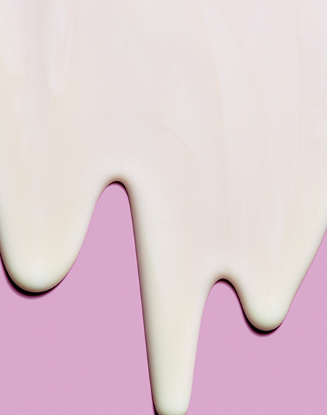 A Mary Kay serum dripping down a purple background