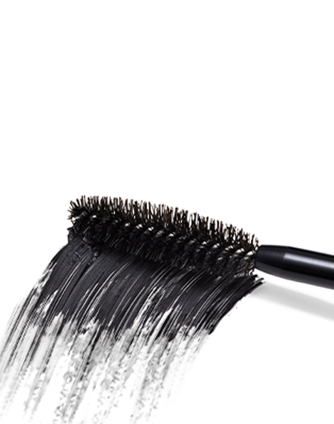 A close-up of a mascara wand highlighting the pigmented black product rub.