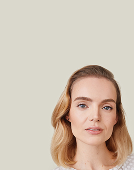 A blonde white woman with beautiful even skin