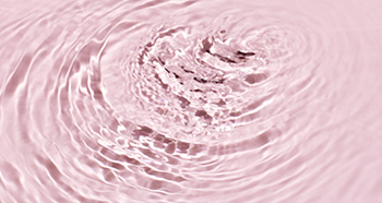 Rippling water on a pink background to represent moisture