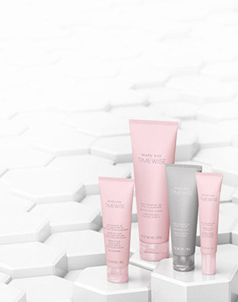 Mary Kay’s new TimeWise Miracle Set 3D products are showcased on white hexagonal pedestals.