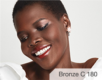 Nina is wearing Matte Bronze C 180 TimeWise 3D Foundation.