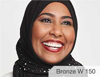 Fatima is wearing Matte Bronze W 150 TimeWise 3D Foundation.