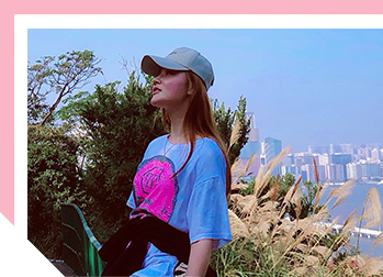 Image of Anne wearing a hat and looking to the distance