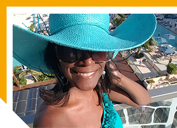 Image of smiling woman in blue hat