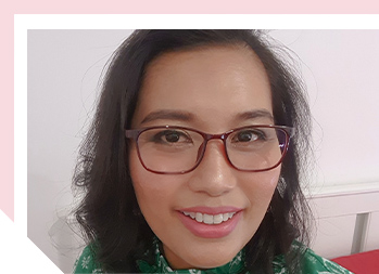 Image of smiling woman wearing glasses