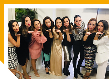 Image of group of women blowing kisses