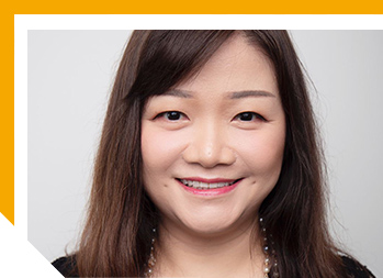 Close up image of Andrea smiling