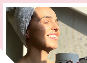 Image of woman smiling in the sunlight