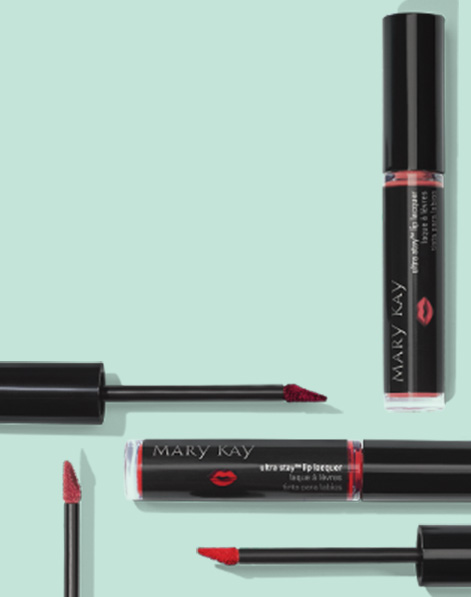 Three Mary Kay Ultra Stay Lip Lacquer Kit shades with open applicators placed horizontal and vertical, so color is exposed.