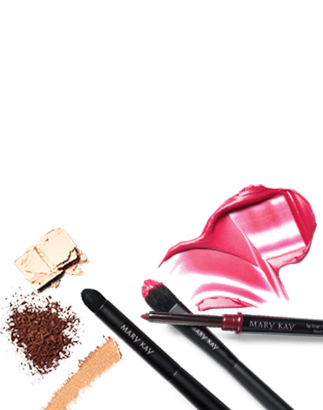 A compilation of rubs and crumbles of eye shadow and lip color along with various Mary Kay makeup brushes.