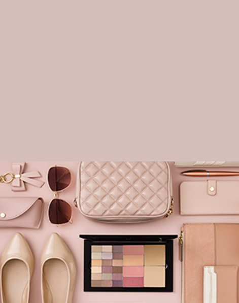 Assorted monochromatic items including shows, sunglasses, a purse and the new Mary Kay Pro Palette are organized in a tidy gridded fashion. 