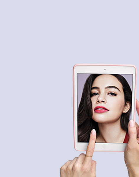 Model wearing stained lip trend from a Mary Kay makeup artist look displayed on held tablet.