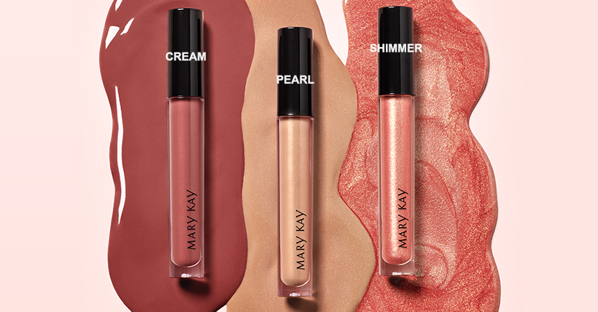Three shades of new Mary Kay Unlimited Lip Gloss, one each in cream, pearl and shimmer finishes.