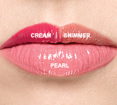  Three shades of new Mary Kay Unlimited Lip Gloss, one each in cream, pearl and shimmer finishes on light ivory skin.
