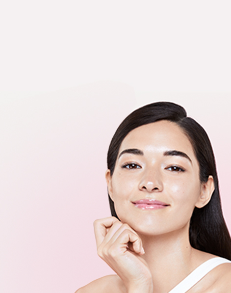 Mary Kay Model touching her face.