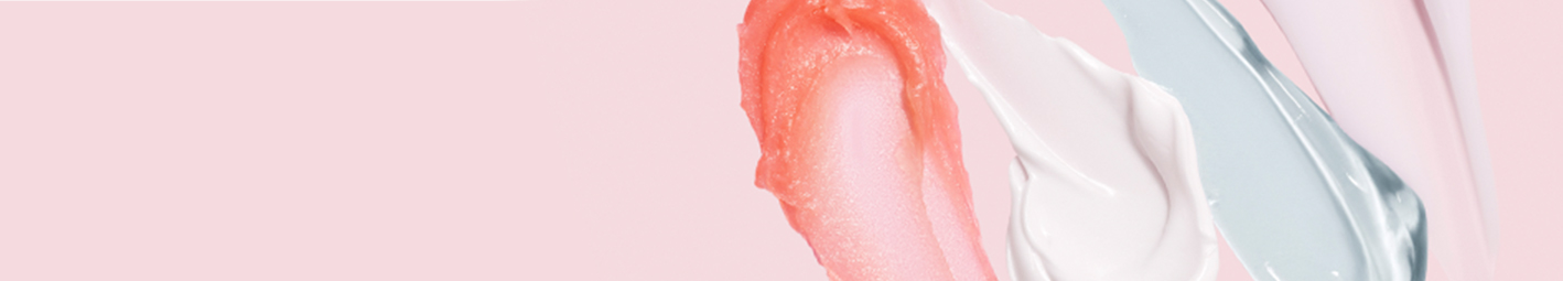 Artistic smears of various Mary Kay skin care products.