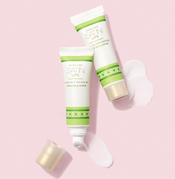 The lip exfoliant Satin Lips Shea Sugar scrub and hydrating Satin Lips Shea Butter Balm in matching tubes with luxurious product smears.