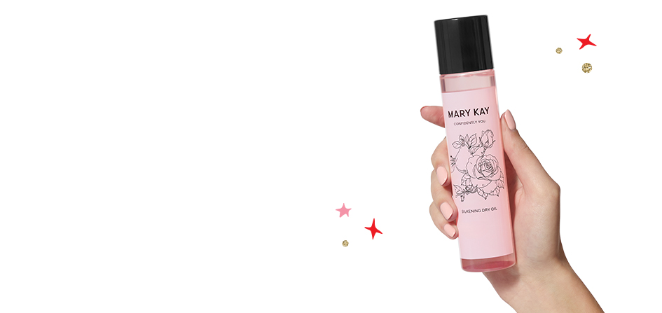 A hand holds Mary Kay Confidently You™ Silkening Dry Oil